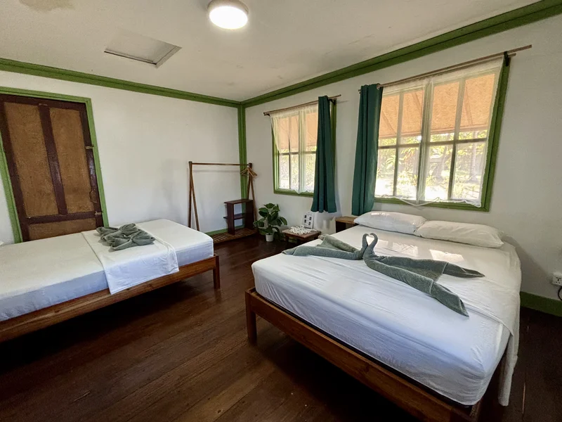 Jungle Haven bungalow room with two Queen beds at DK2 Resort, Palawan