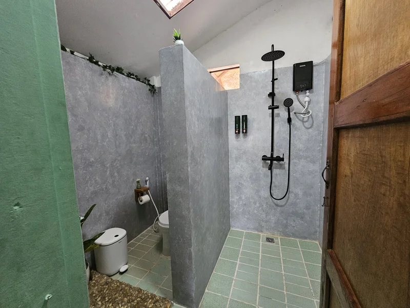 Private shower and toilet compartment with its own door in the Palmscape bathroom, DK2 Resort Palawan