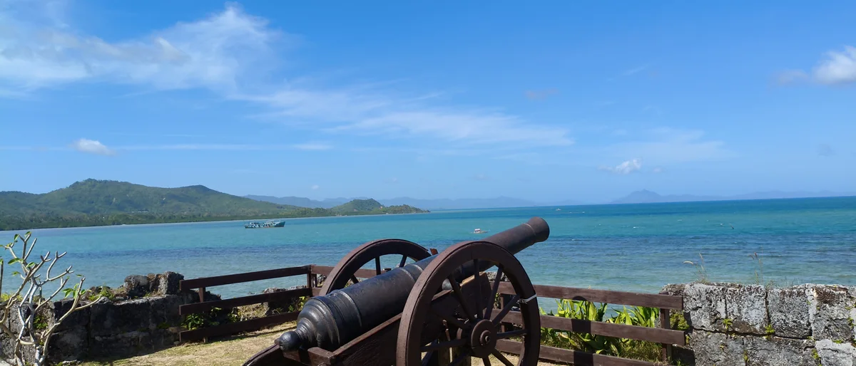 Historic cannon overlooking the turquoise bay at Taytay's 1738 Spanish fort, Palawan